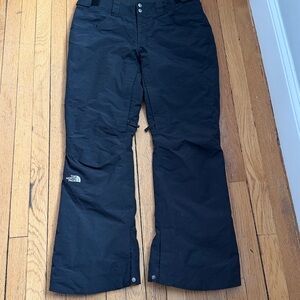 The Northface woman’s black snow pants size L EUC